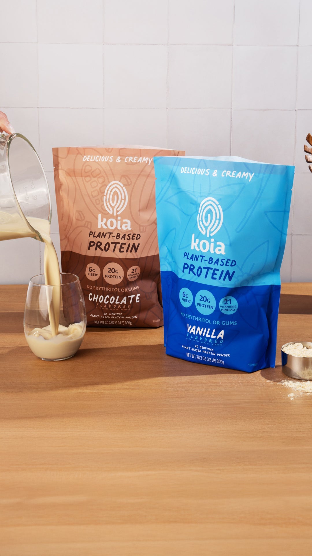 Koia protein powder poured into a blender with kitchen elements